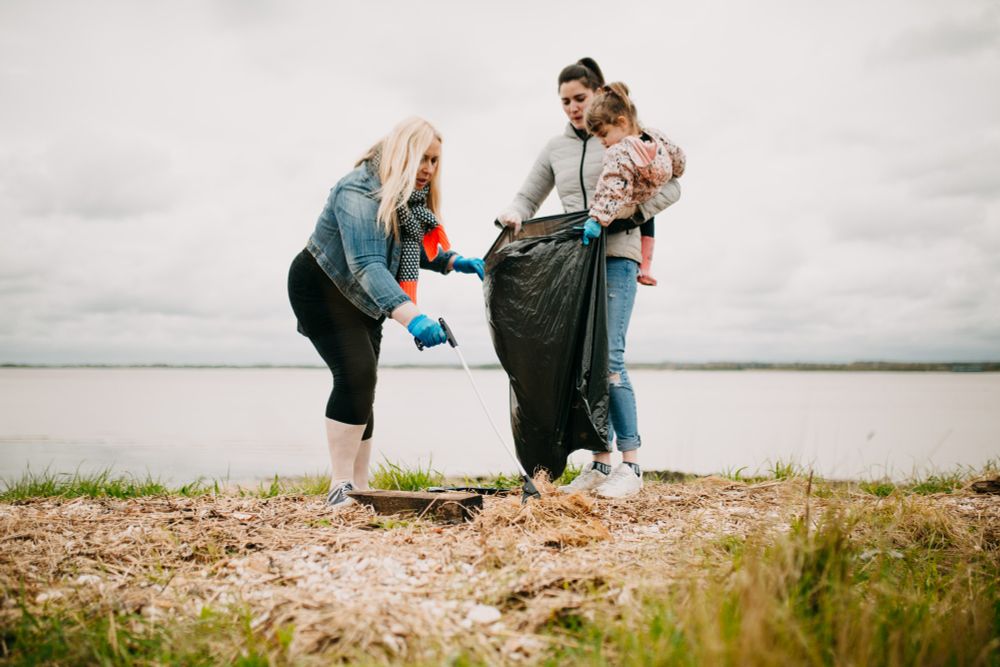 Family taking part in a beach clean. 