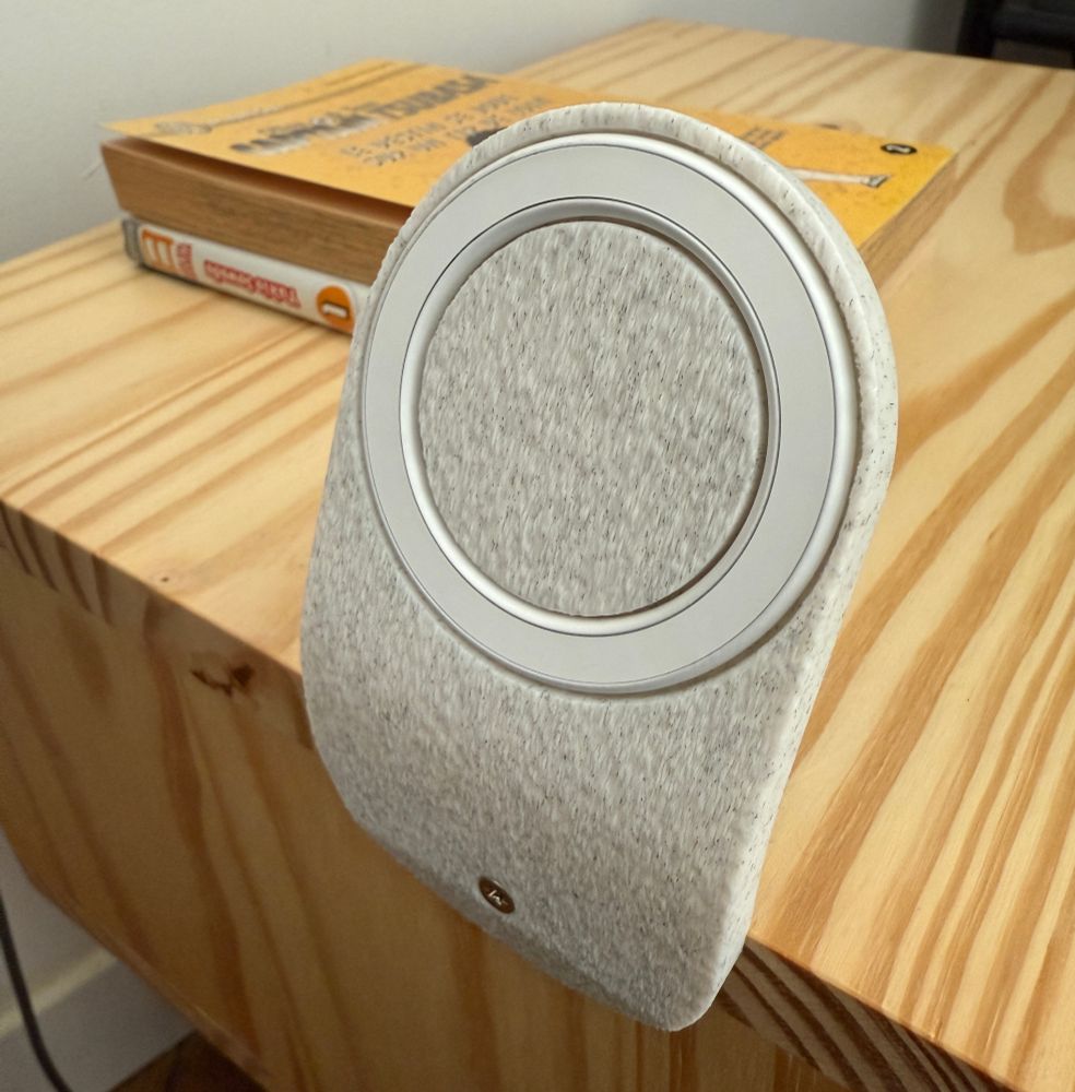 Slanted Magnetic phone holder screwed onto the edge of a pine nightstand