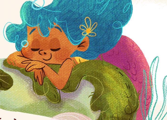 close up of the mermaid sleeping/listening to the book