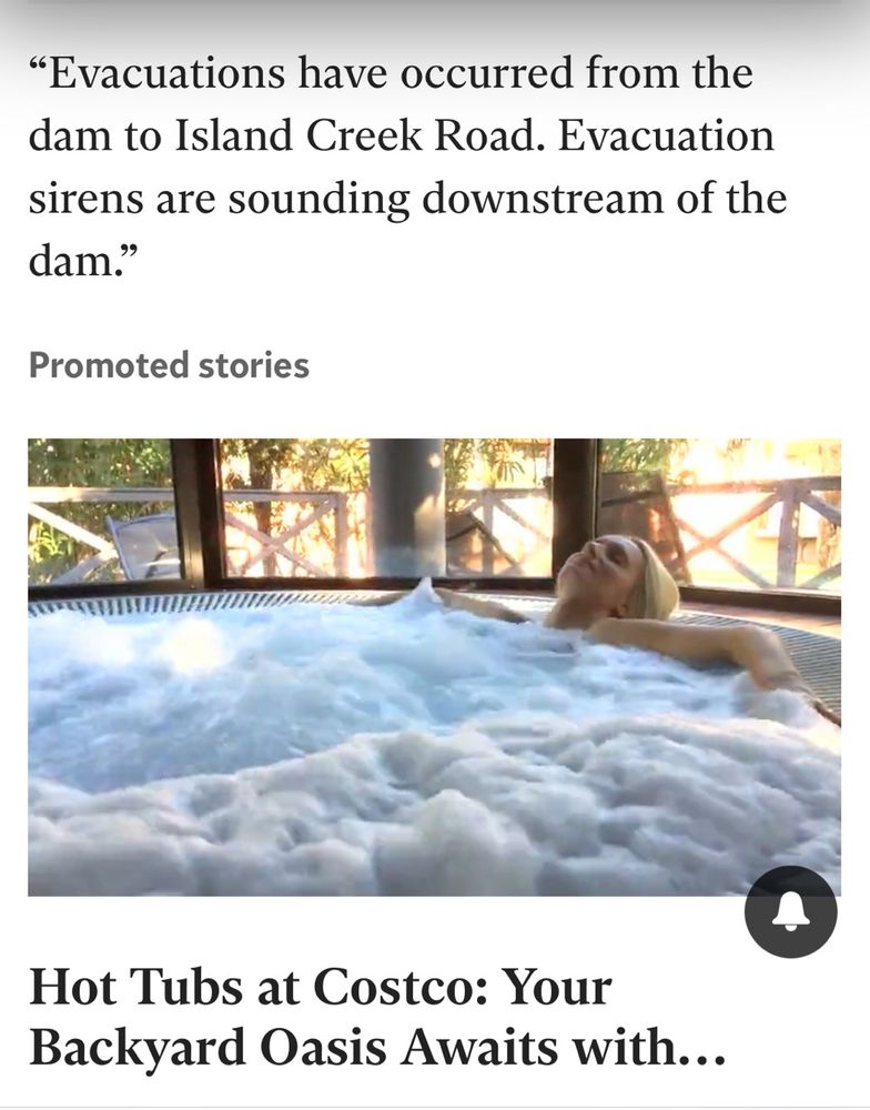 A web news item covering flooding from the hurricane, above an ad for hot tubs with a woman sinking into the water