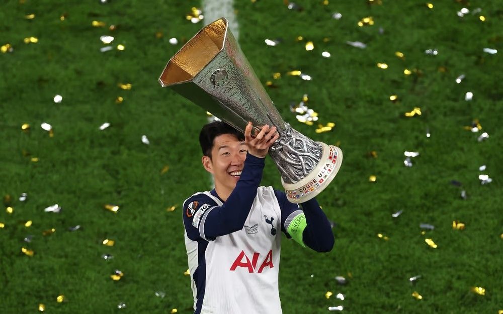 Son lifting the Europa League trophy, with that smile. Legend.
