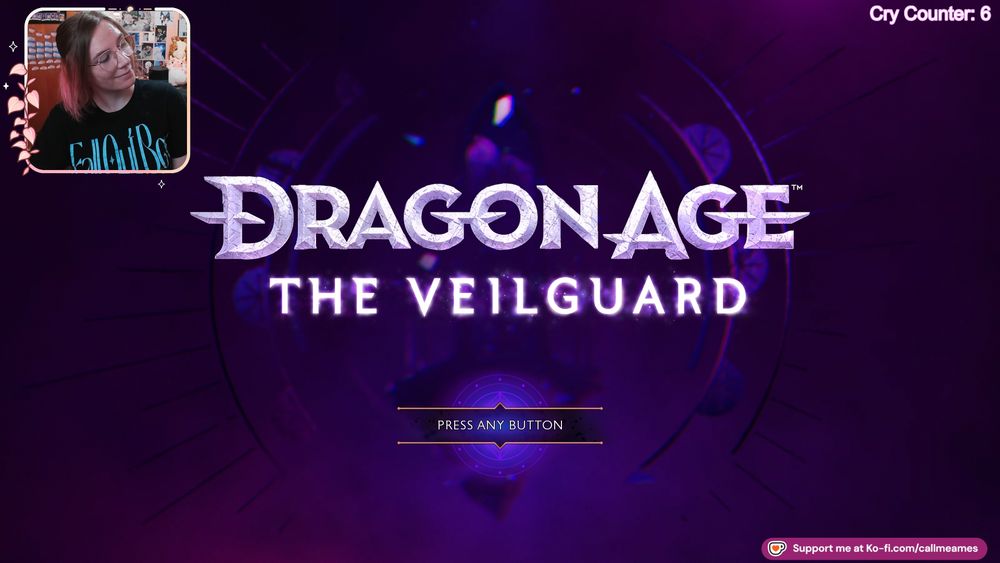 Ames' facecam over the splash screen for Dragon Age: The Veilguard. They are wearing a black shirt that says fall out boy in blue text. In the top right corner is a cry counter showing that they've cried 6 times over this playthrough.
