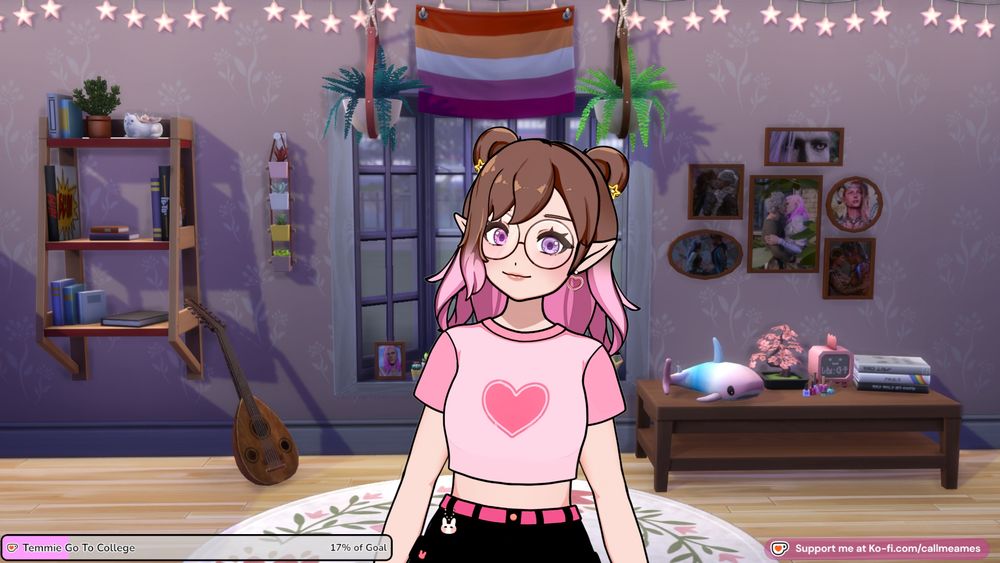Ames' vtuber: a white humanoid model with shoulder length brown hair that turns pink in an ombre with double space buns held in place by small, pink heart clips. They have pointed elf ears and are wearing yellow star earrings. She has a pink crop top with a heart on it with black shorts. There is a bunny charm hanging off their belt loop. Behind her is a screenshot from the sims 4 of a bedroom with lilac walls. There is a bookshelf to one side beside them and a table with knicknacks on the other. There is a cluster of photoframes containing their tavs from baldur's gate 3 on the wall. Directly behind them is a bay window with a lesbian flag at the top of it.