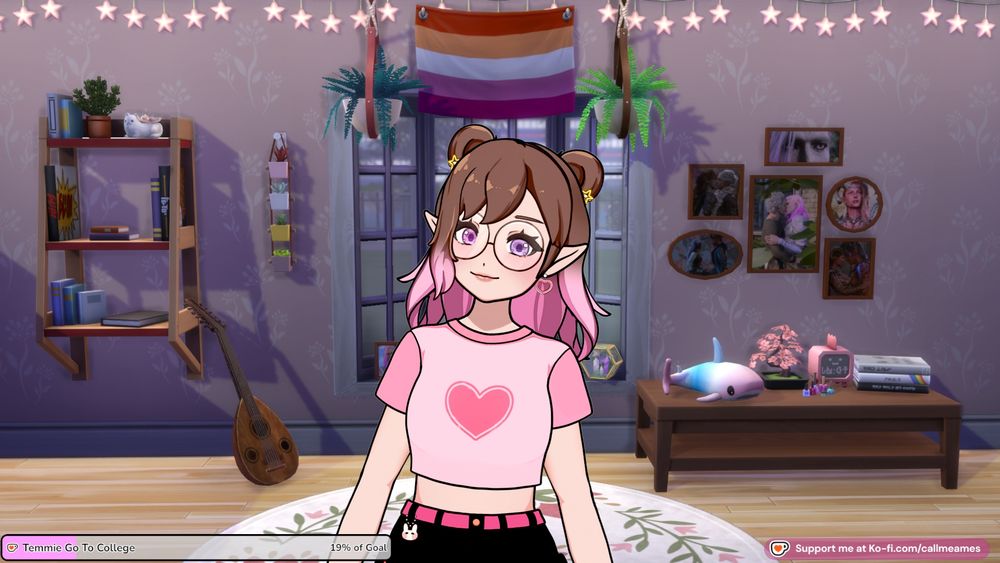 Ames' vtuber: a white humanoid model with shoulder length brown hair that turns pink in an ombre with double space buns held in place by small, pink heart clips. They have pointed elf ears and are wearing yellow star earrings. She has a pink crop top with a heart on it with black shorts. There is a bunny charm hanging off their belt loop. Behind her is a screenshot from the sims 4 of a bedroom with lilac walls. There is a bookshelf to one side beside them and a table with knicknacks on the other. There is a cluster of photoframes containing their tavs from baldur's gate 3 on the wall. Directly behind them is a bay window with a lesbian flag at the top of it.