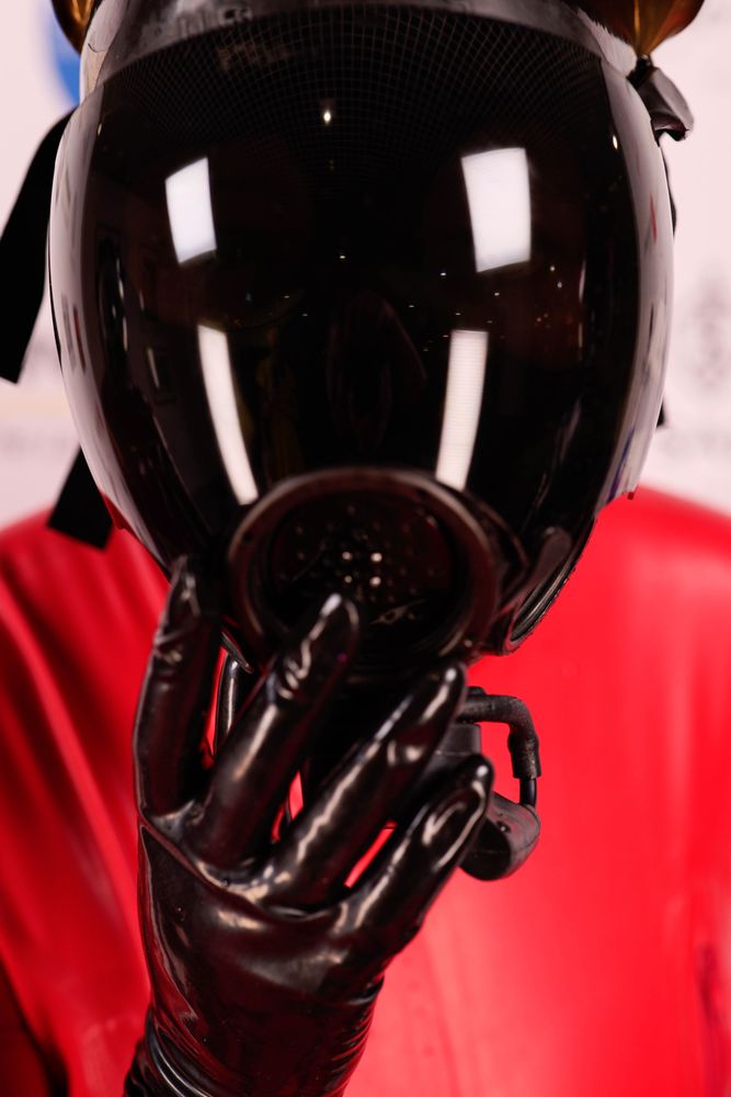 an extremely close up shot of ToyDolly in an MSA Millenium gas mask. good drone. 