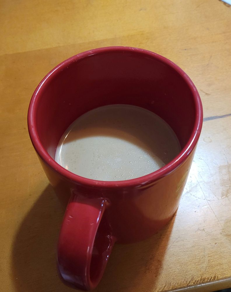 Tibetan butter tea in a red cup