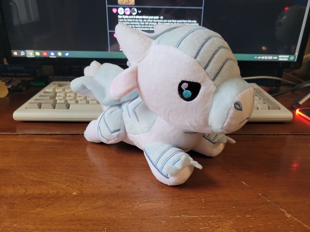 Photo of a plush dragon of Winter from Wings Of Fire.