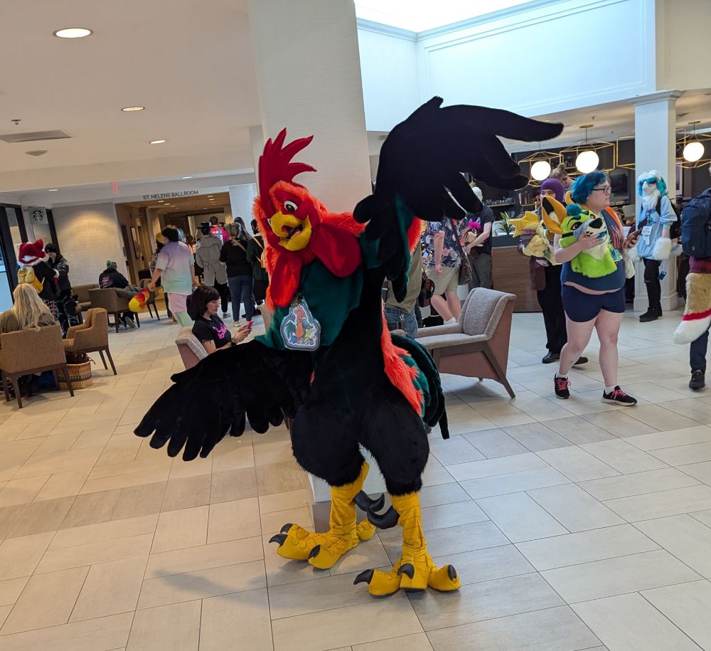 Rochester Rooster spreads his wings for a photo at the PDX Sheridan 