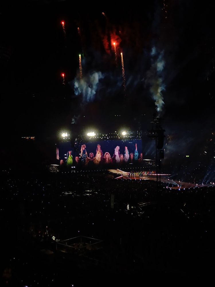 taylor and her dancers doing the karma bow. fireworks in the background
