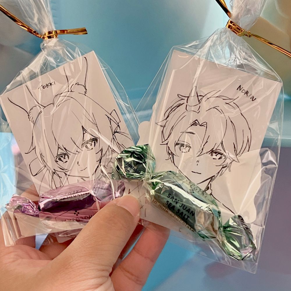 Gifts from @/OyunOrka; two goodie bags containing a drawing of Tokki and Norin, plus chocolate. 🍫 