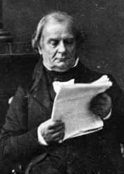 Photo of a nineteenth century French man glaring disapprovingly at some paper