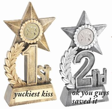 An image of two trophies, one is for 1st place and labelled "yuckiest kiss" and the 2nd place one is labelled "ok you guys saved it"