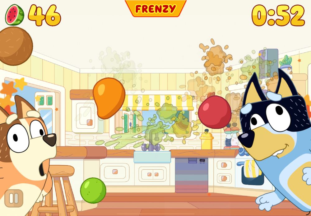a screenshot of Fruit Ninja Classic+ from an iPad. The background is the kitchen from Bluey, and in the foreground is Chilli on the left squawking like a chicken from the episode “Asparagus” and Bandit on the right making a walrus face. There’s an Apple, Mango, and Coconut flying across the screen. 