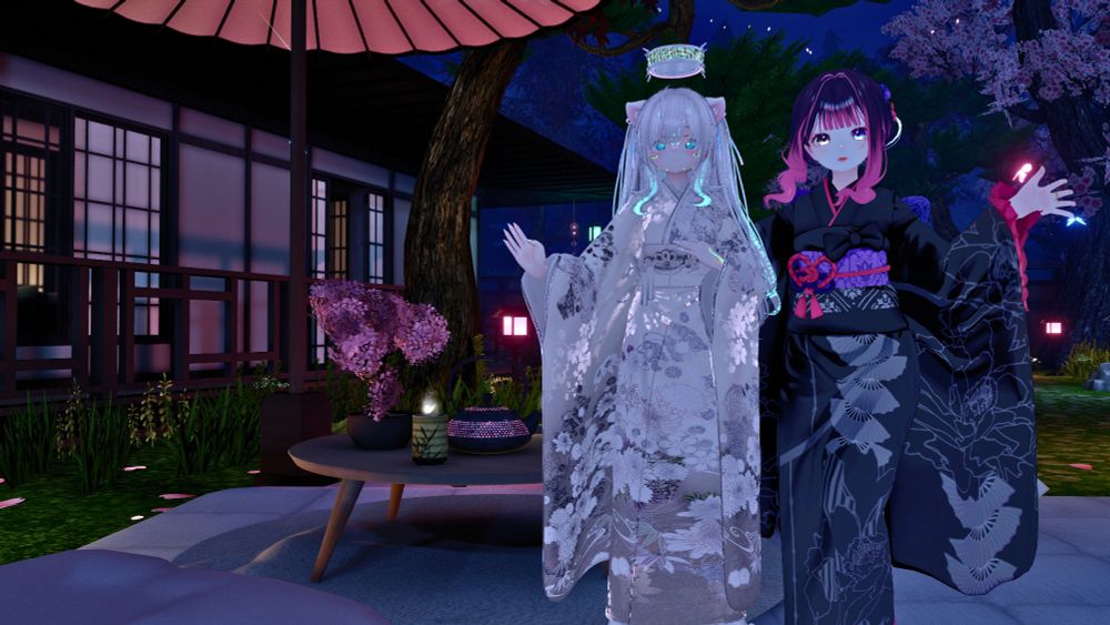 Two girls (one being a stinky british man) dressed in kimono's posing together nicely in a Japanese themed and styled garden.