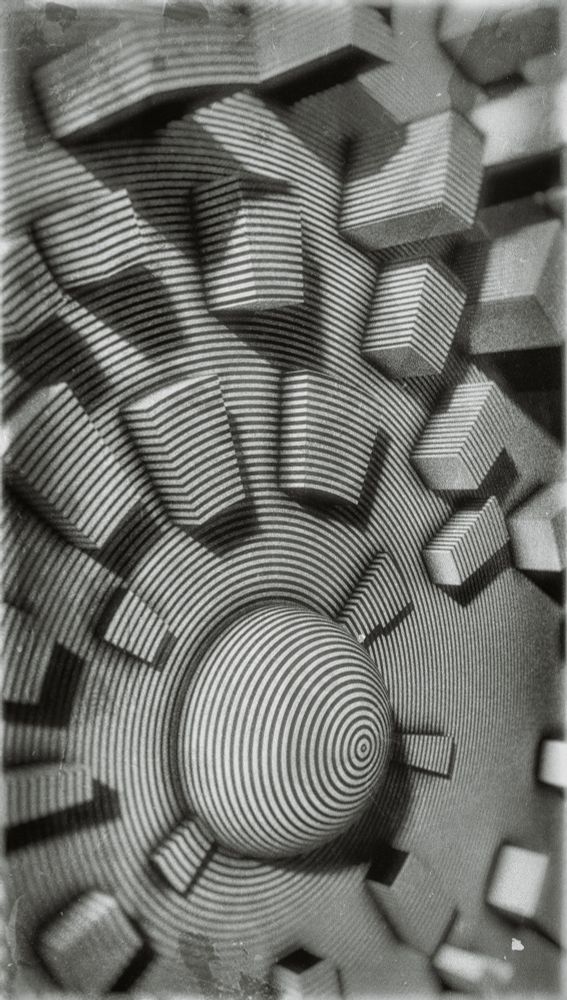 black and white concentric abstract raised design.