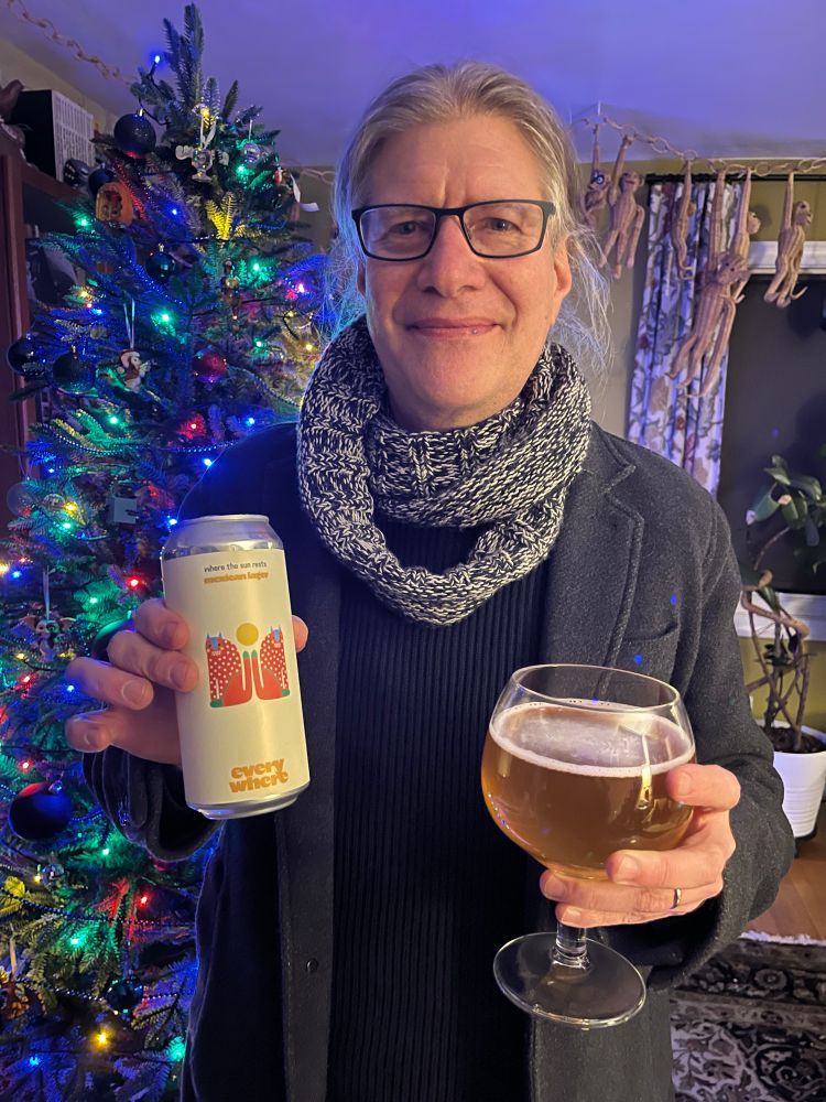 The middle aged white man with the long blond ponytail holds a beer can and a goblet of beer. He stands in front of a festively lit Christmas tree. He’s still wearing his wool coat and a scarf for some reason that escapes me now. The wicker monkeys align on a wicker chain that hangs from the ceiling and stretches across the room. Are they plotting an assault on the Christmas tree or wishing that they too had an advent calendar of curated beers. No one will ever know because I just spent an outrageous amount of time fighting autocorrect, which was certain the wicker monkeys would prefer a curated collection of “bears” or “beets” but not beer. The middle aged man with the long blond ponytail will need to comment on the type of bear he received and his enjoyment of same.