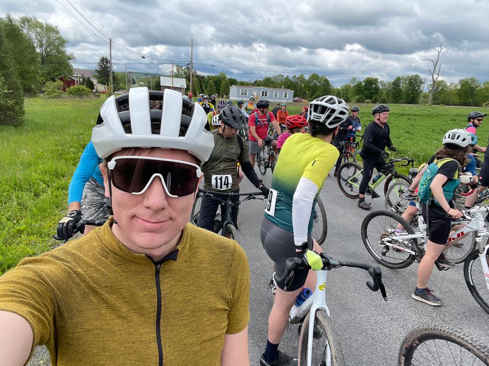 A guy who looks pretty excited to start a bike race!