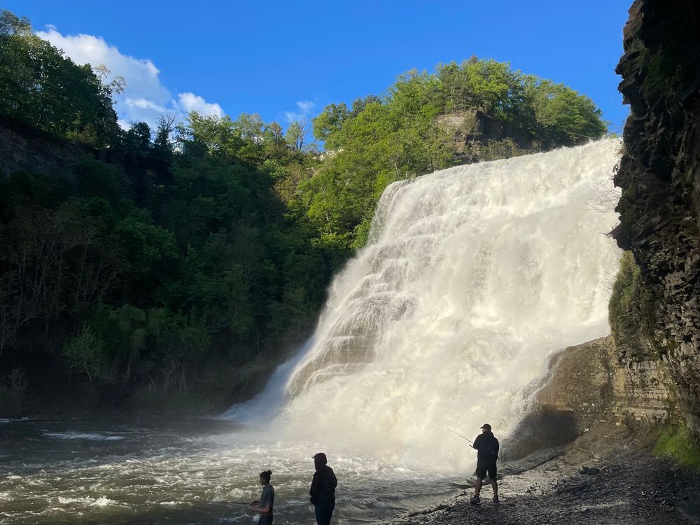 Ithaca falls, under a blue sky.