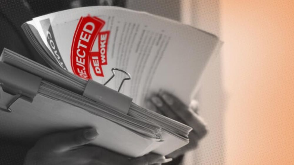 A person looking through a pile of paperwork with “Rejected, DEI and Woke” stamped on it.