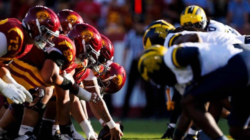 USC Trojans offense at the line of scrimmage before an extra point attempt during the game against Michigan Wolverines at Los Angeles Memorial Coliseum on Oct. 11, 2025, in Los Angeles