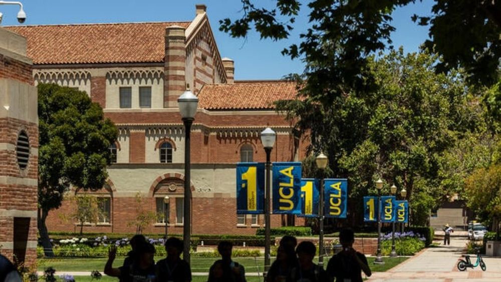 People walk around UCLA campus.