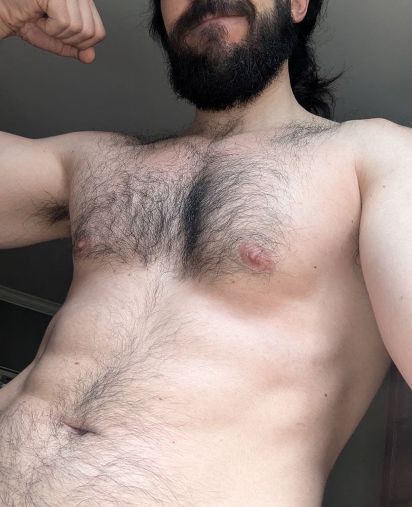 A 3/4 view of my torso and chest and beard. 