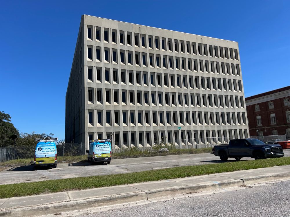 Brutalist building in North Charleston 
Six rows of windows, each row has approximately 20 windows along the row.