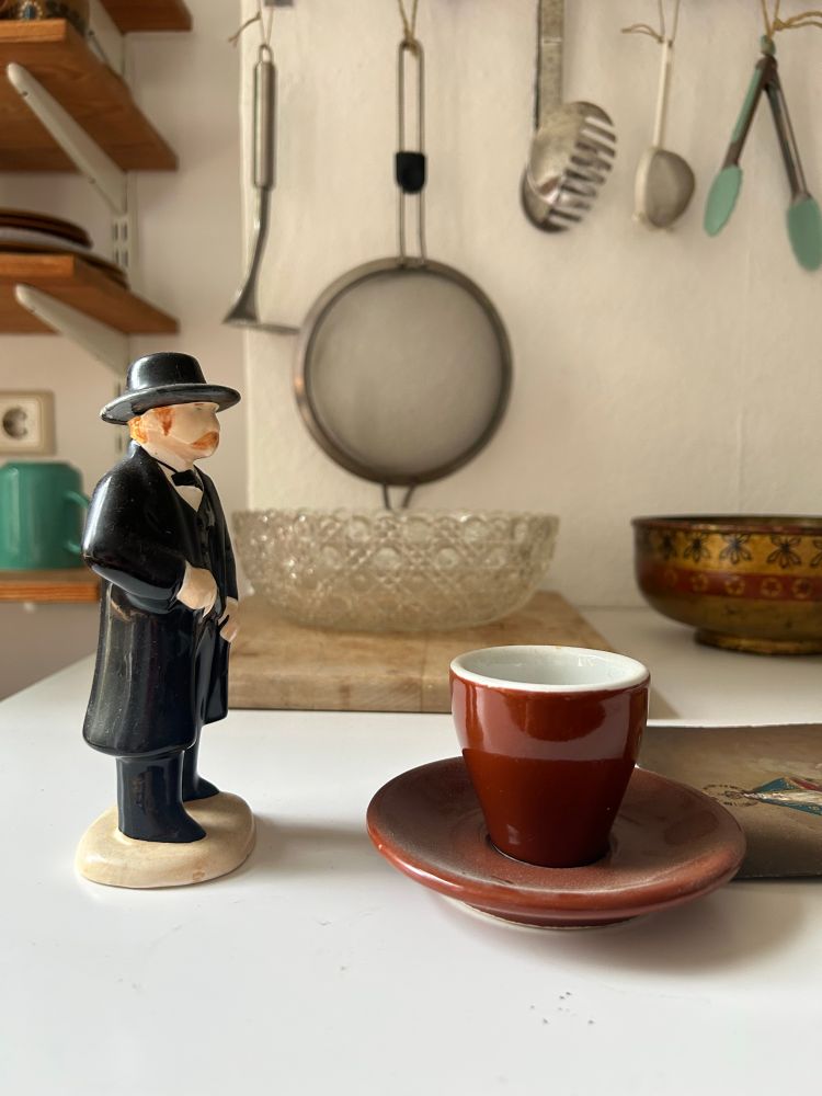 Western-looking sherrif figure and espresso cup