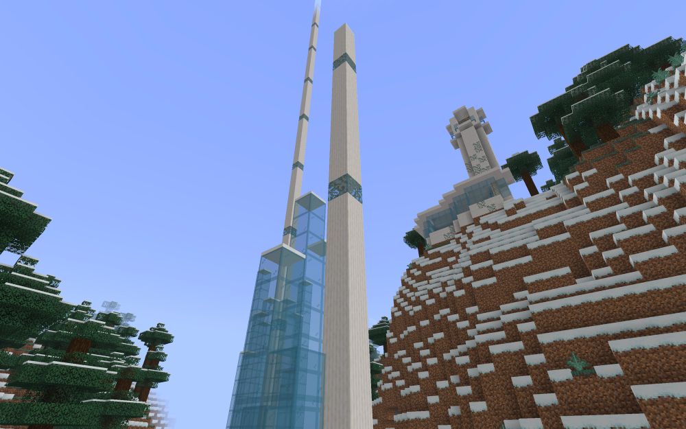 Two quartz Minecraft towers that count how many comic pages I’ve drawn in a year. The farther one is much taller than the closer one.