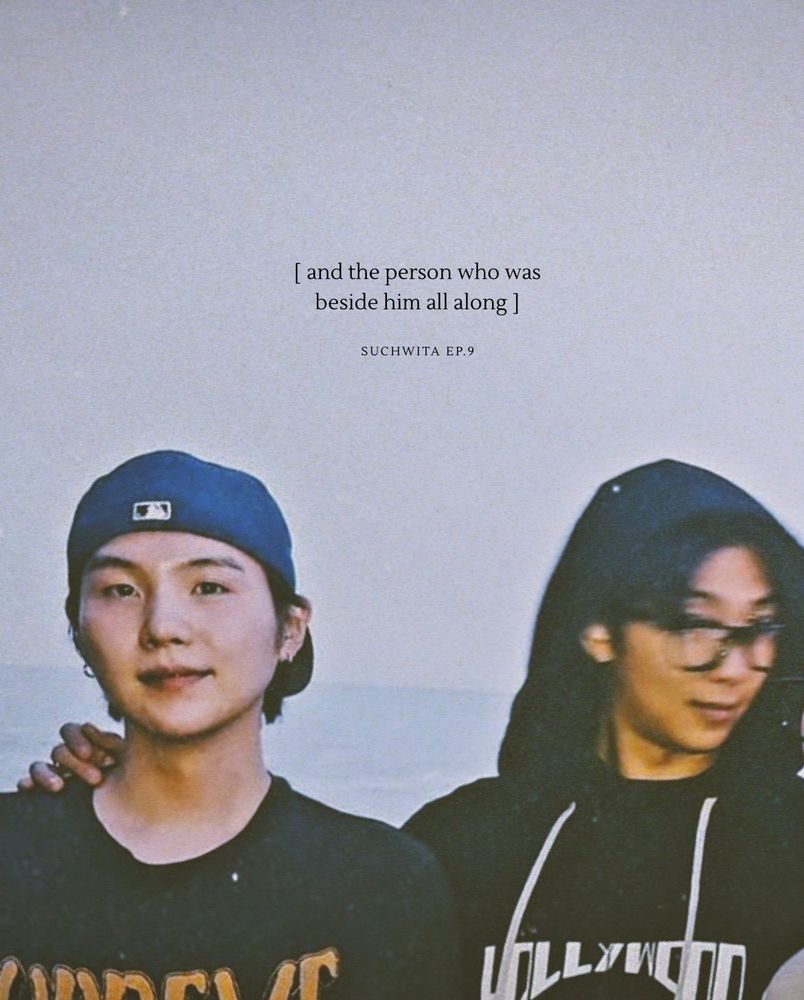 A cropped version of BTS group photo showing namgi with Namjoon's hand on Yoongi's shoulder, with the text "[and the person who was beside him all along] -suchwita ep 9" edited above their heads, by lizzyfaith on twt