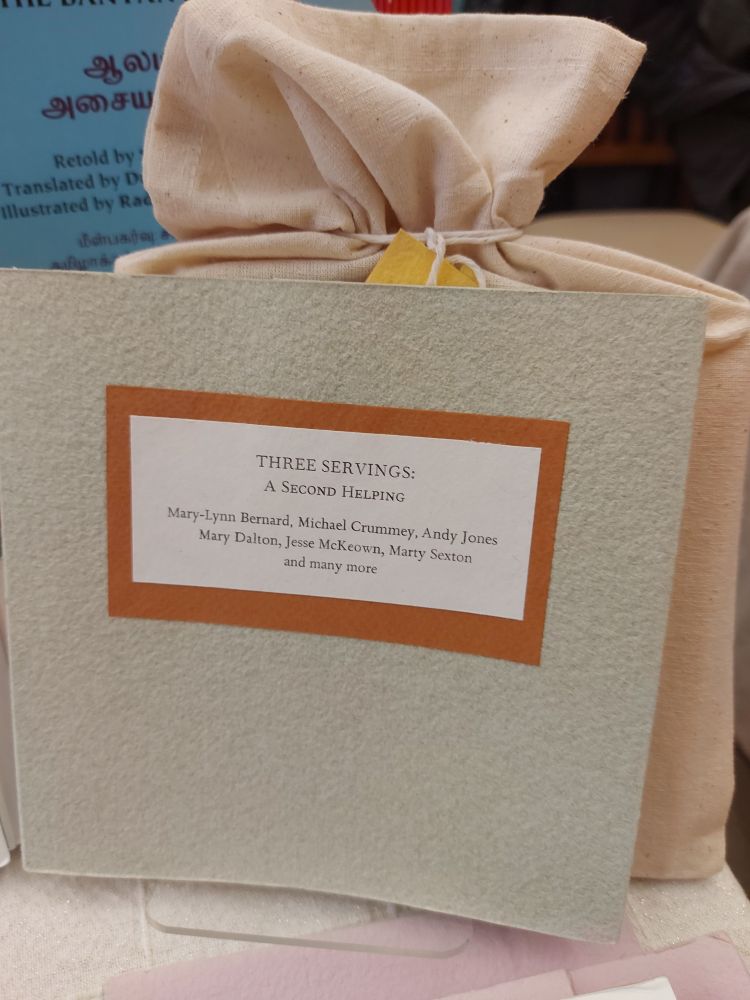 A photo of a handmade books. It is Three Servings: a second helping. But Mary-Lynn Bernard, Micheal Crummey, Andy Jones, Mary Dalton, Jesse McKeown, Mary Sexton and many more