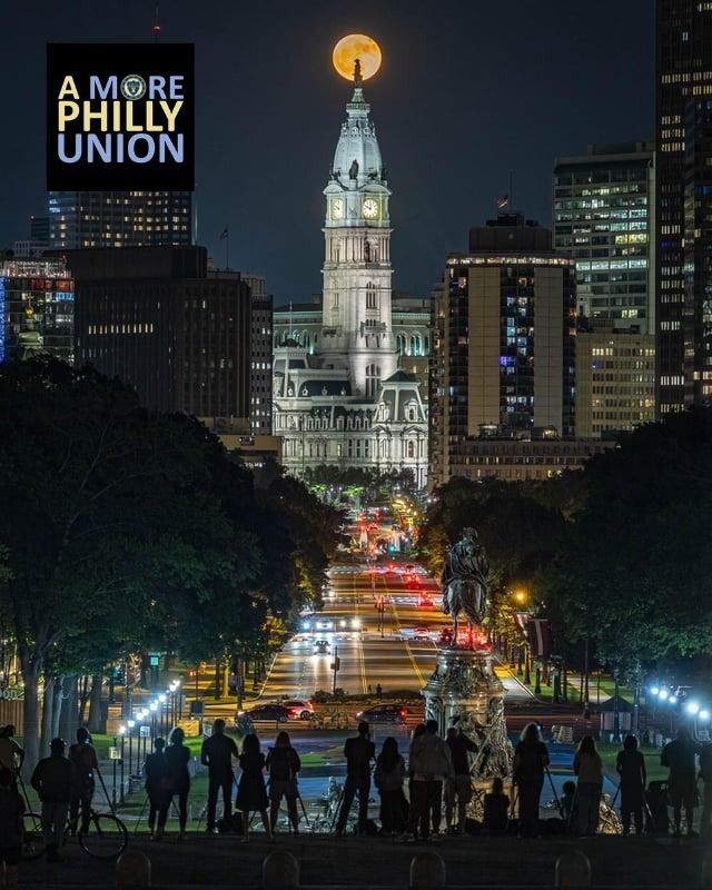 Philadelphia's city hall with the strawberry moon behind it, June 11, 2025, by Justin Curtis Photo, with the A More Philly Union logo added