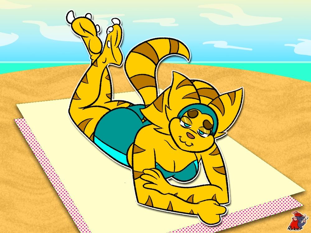 Angela Cross lounging on a beach towel in the sun