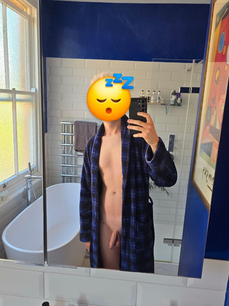 Selfie of me, taken in the bathroom mirror. I'm wearing a dressing gown and it's fallen open at the front so you can see my body and soft cock.