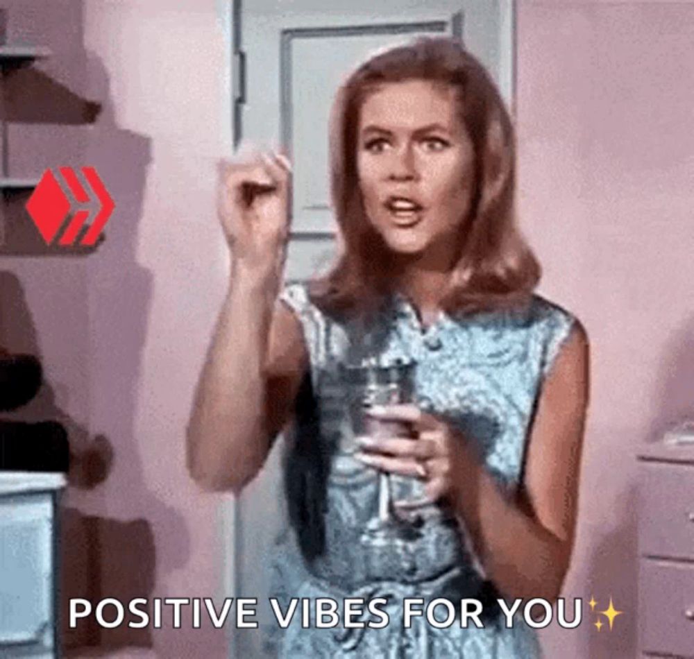 a woman is holding a glass of wine and saying " positive vibes for you "