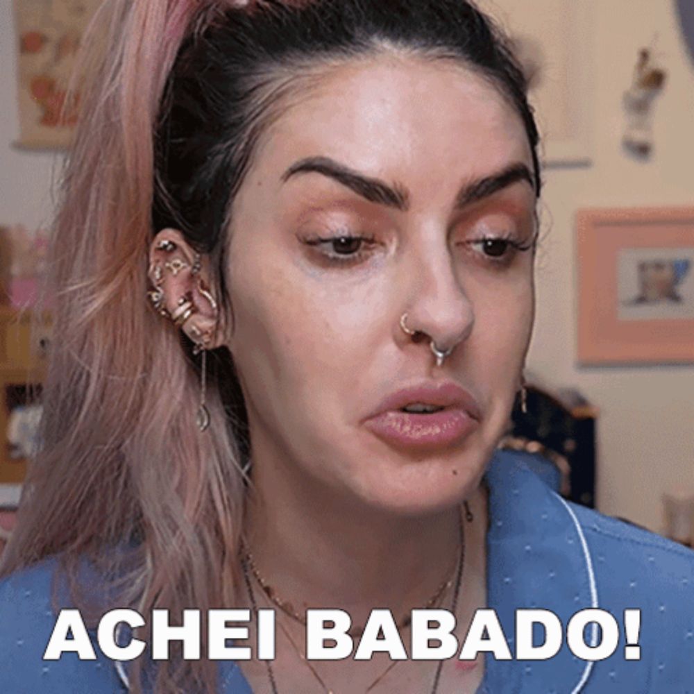 a close up of a woman 's face with the words achei babado on the bottom