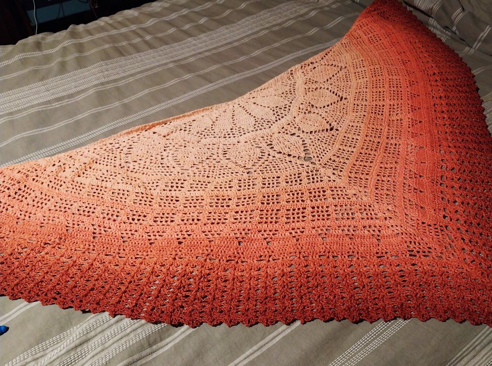 Crochet shawl in orange ombre