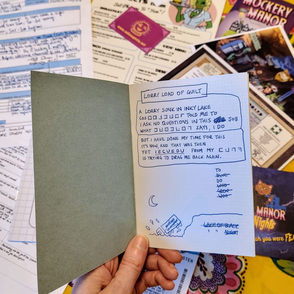 Someone holding open a workbook jotter containing cryptic coded notes.