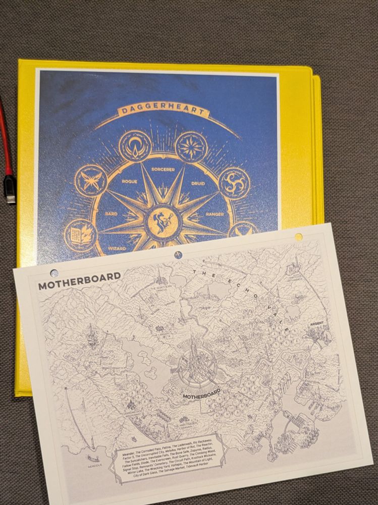 Printed copy of Daggerheart Motherboard map with adversaries binder