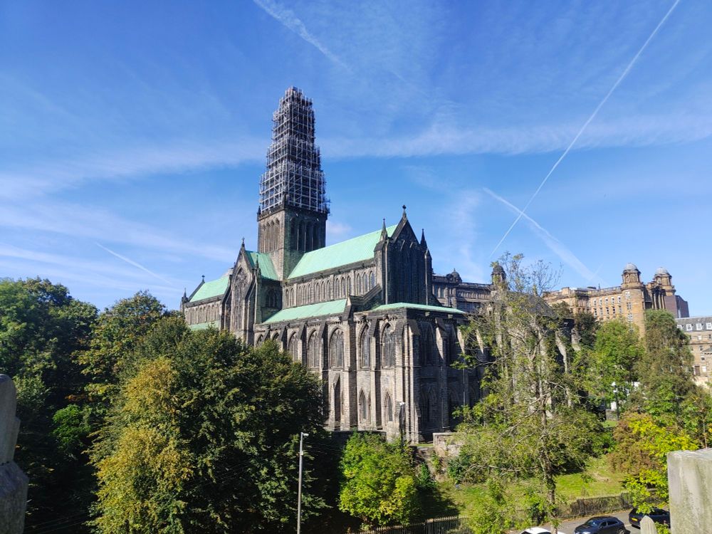Image shows Glasgow Cathedral against a blue sky