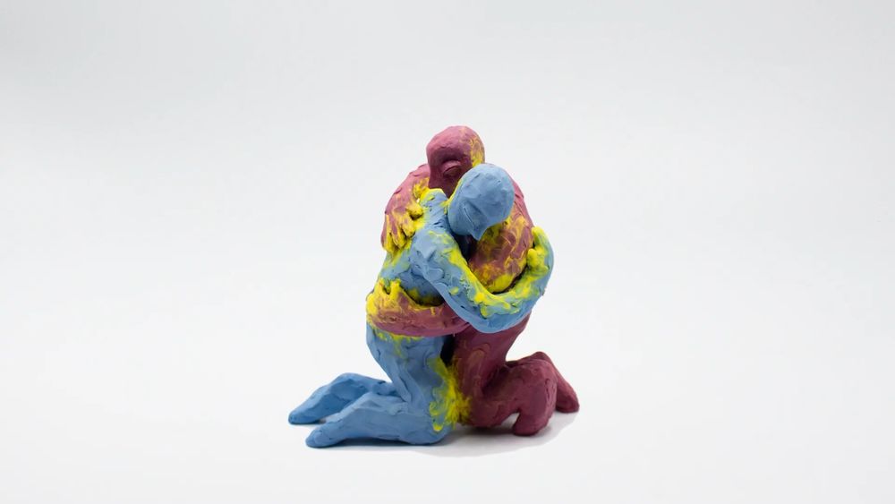 Two plasticine characters hugging