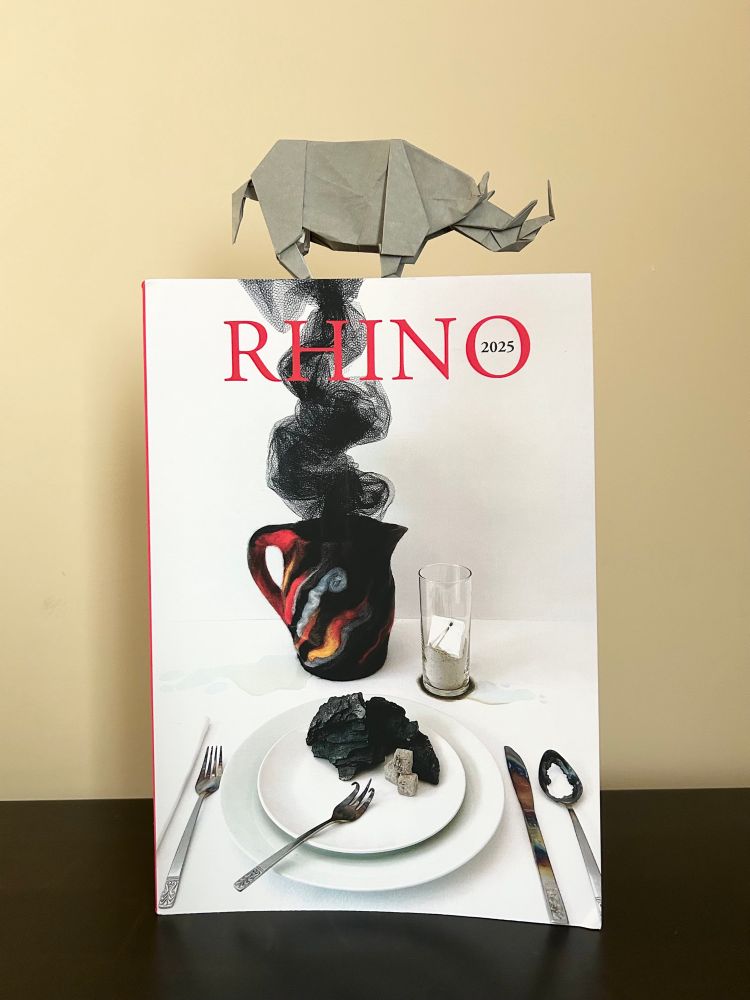 RHINO 2025 poetry journal with origami rhinoceros on top. 