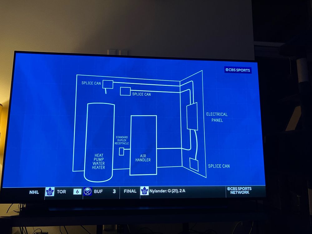 A blueprint schematic of a an electrical panel, air handler, heat pump, and splice cams. 