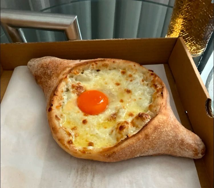 Georgian cheese bread with an egg yolk. 