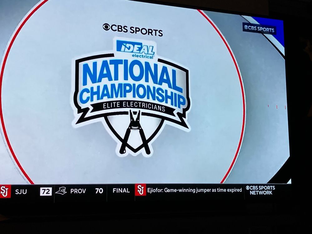 Logo for the National Championship Elite Electricians - it has a wire cutter on a shield