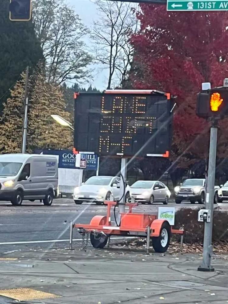 Road sign reading "LANE SHIFT M-F"