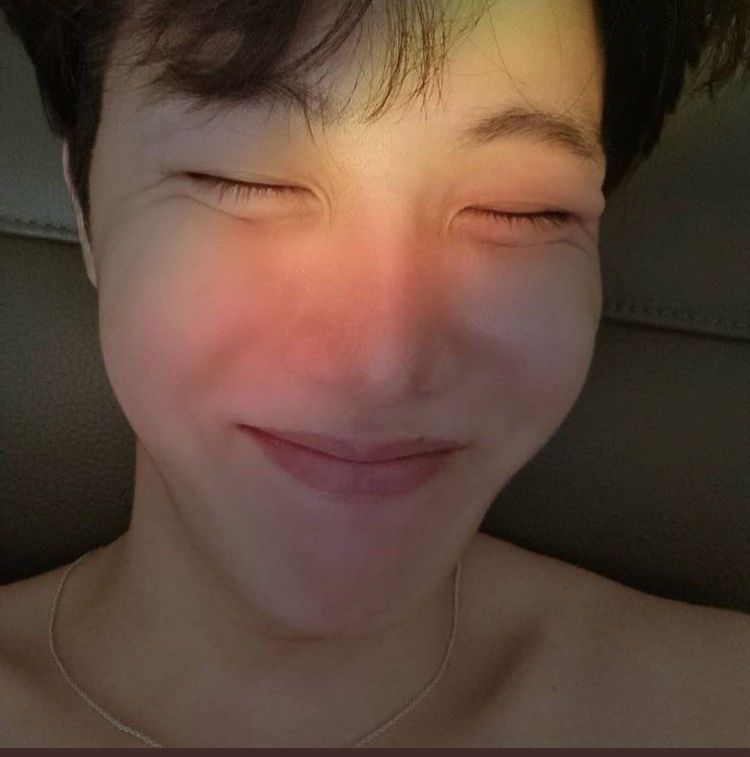 Hoseok of BTS. Closeup selfie of his smiling face