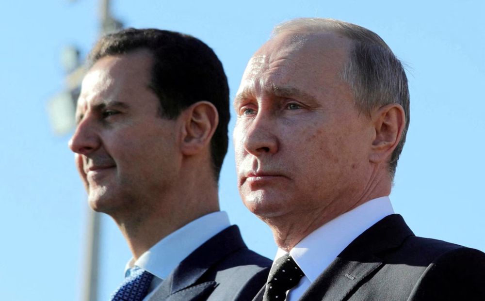 Syria’s Assad and Russia’s Putin side by side.