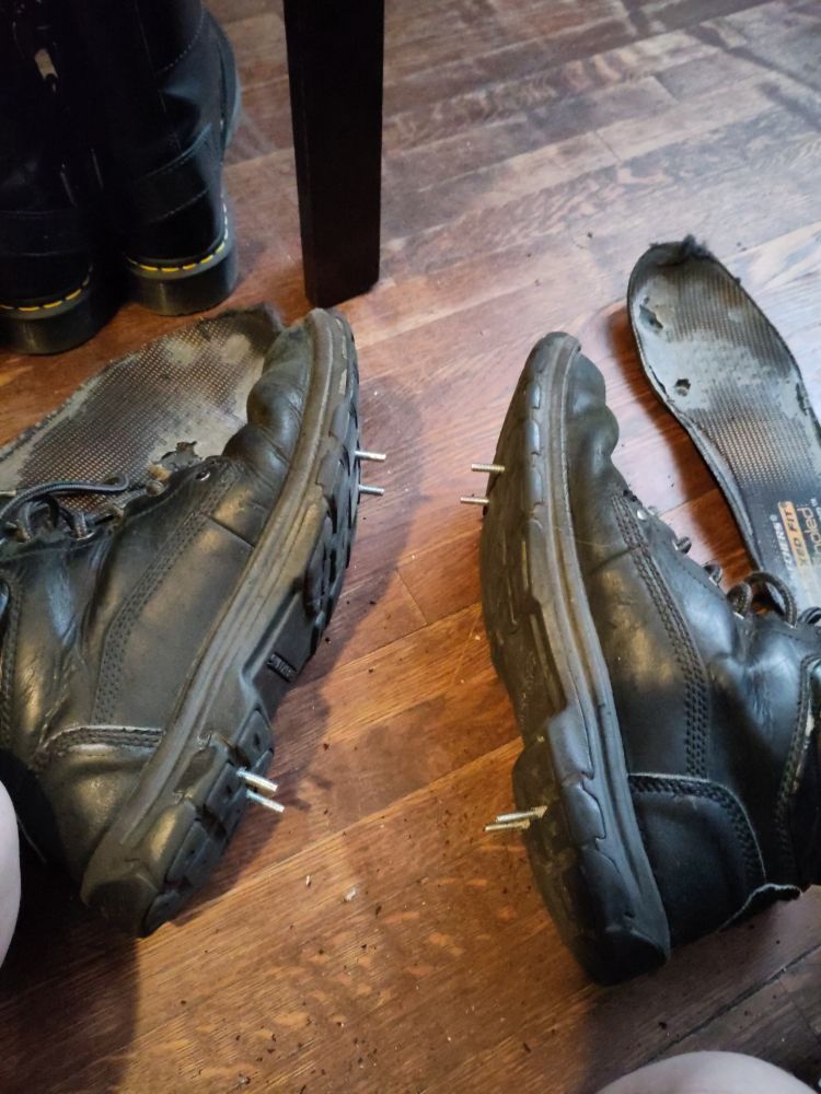 Vvn's boots with bolts through the bottoms