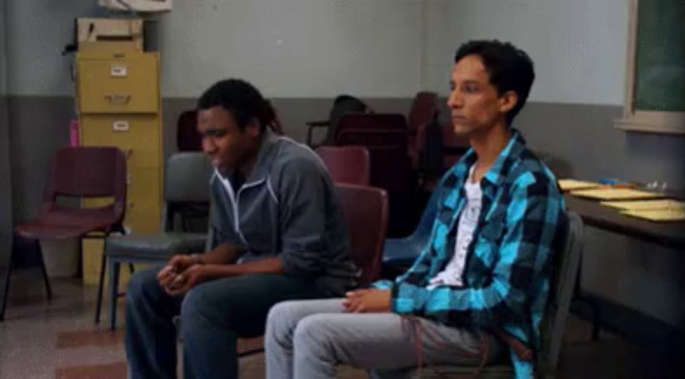 header image - a man in a blue plaid shirt sits next to another man in a gray jacket